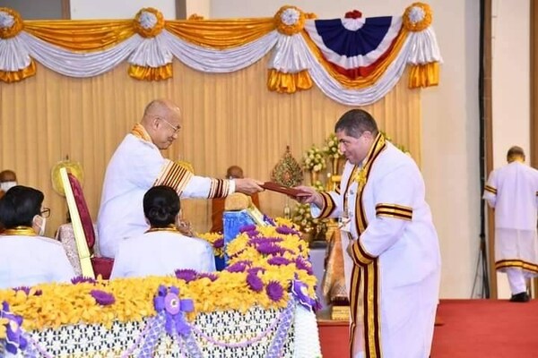 Thailand's Vocational Education Institute awards an honorary degree to Mark Brinn for outstanding contribution to agricultural machinery education